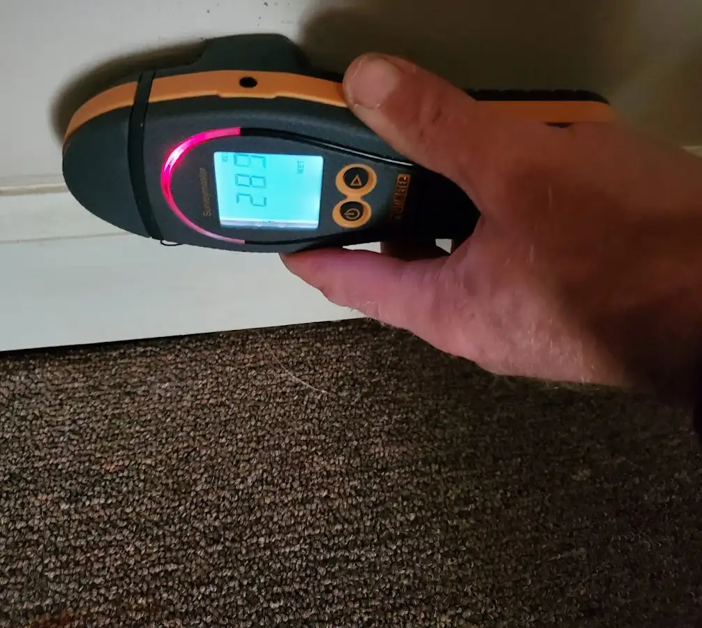 Moisture detection at baseboard during Storm Damage Restoration in Bethalto